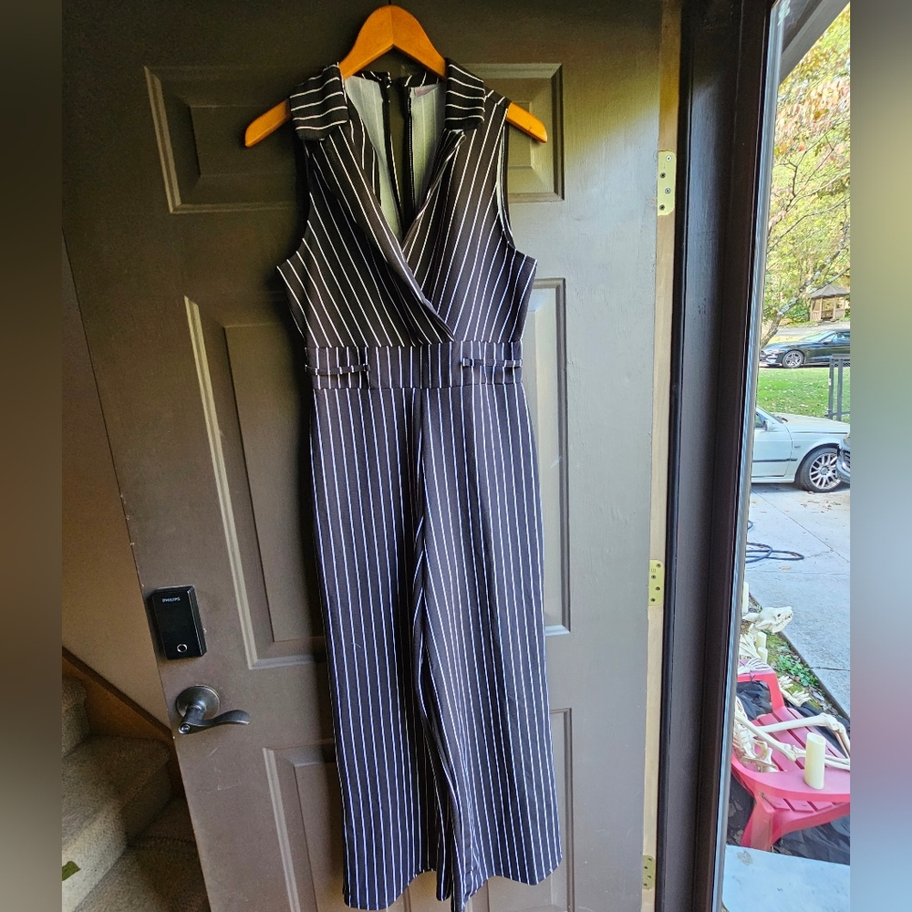 No boundaries, L black and white pen stripped jumpsuit.